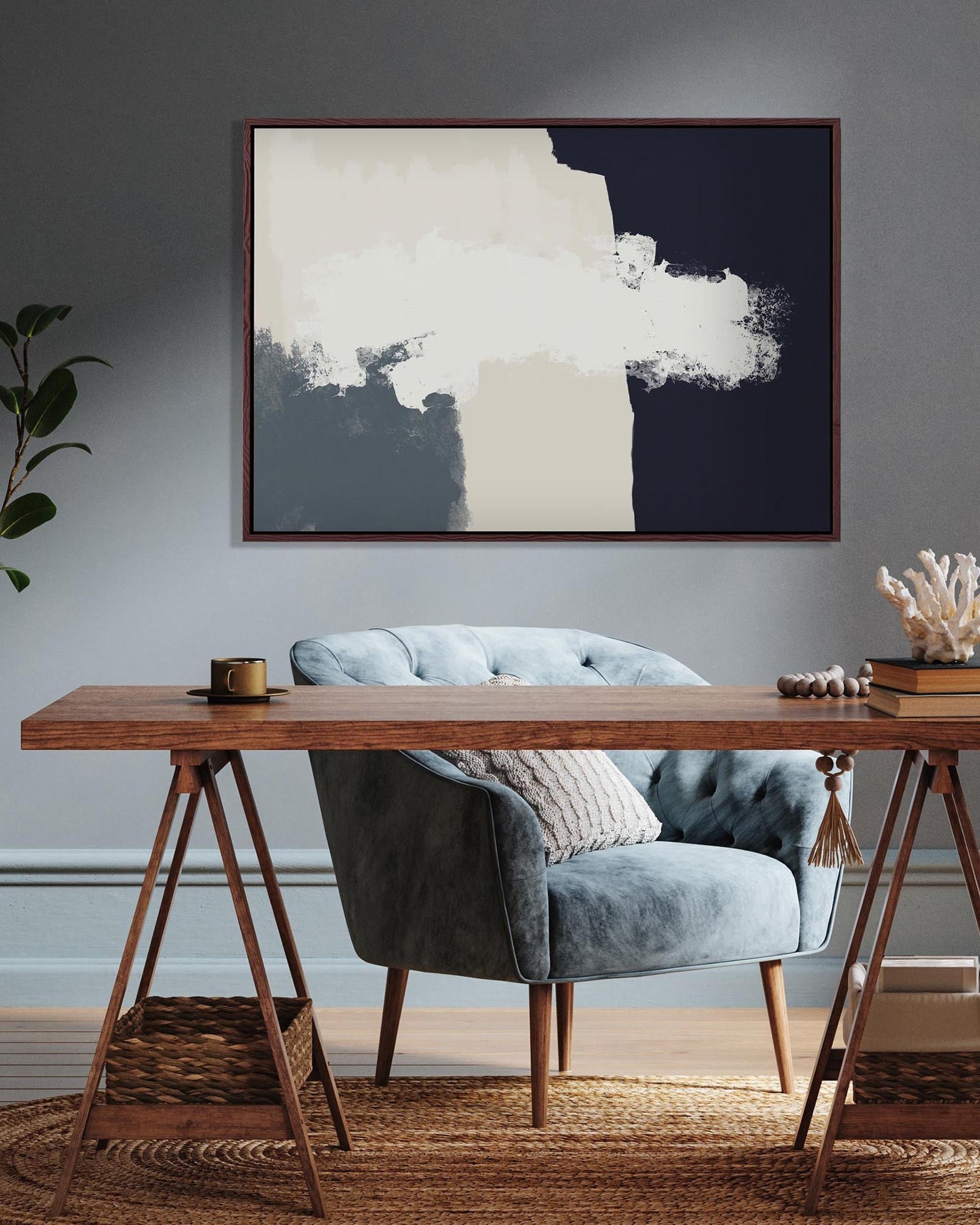 Modern interior with a wooden desk, gray chair, and abstract art on the wall.