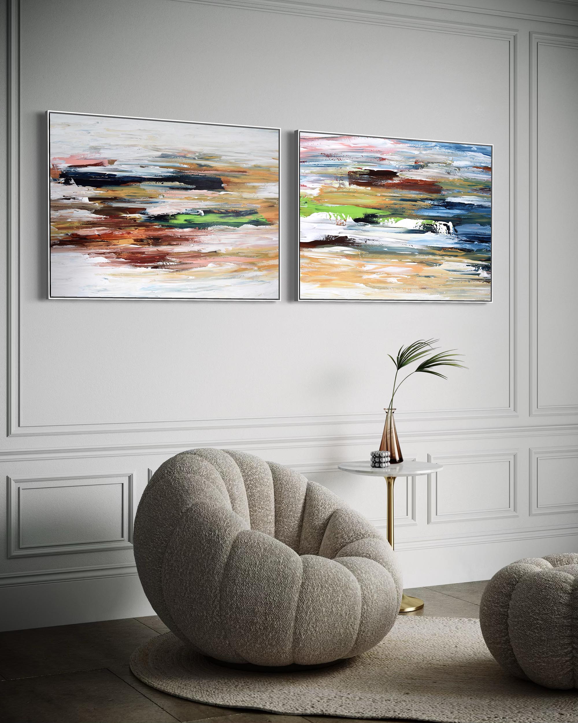 Two abstract paintings on a wall above a modern chair in a stylish room.