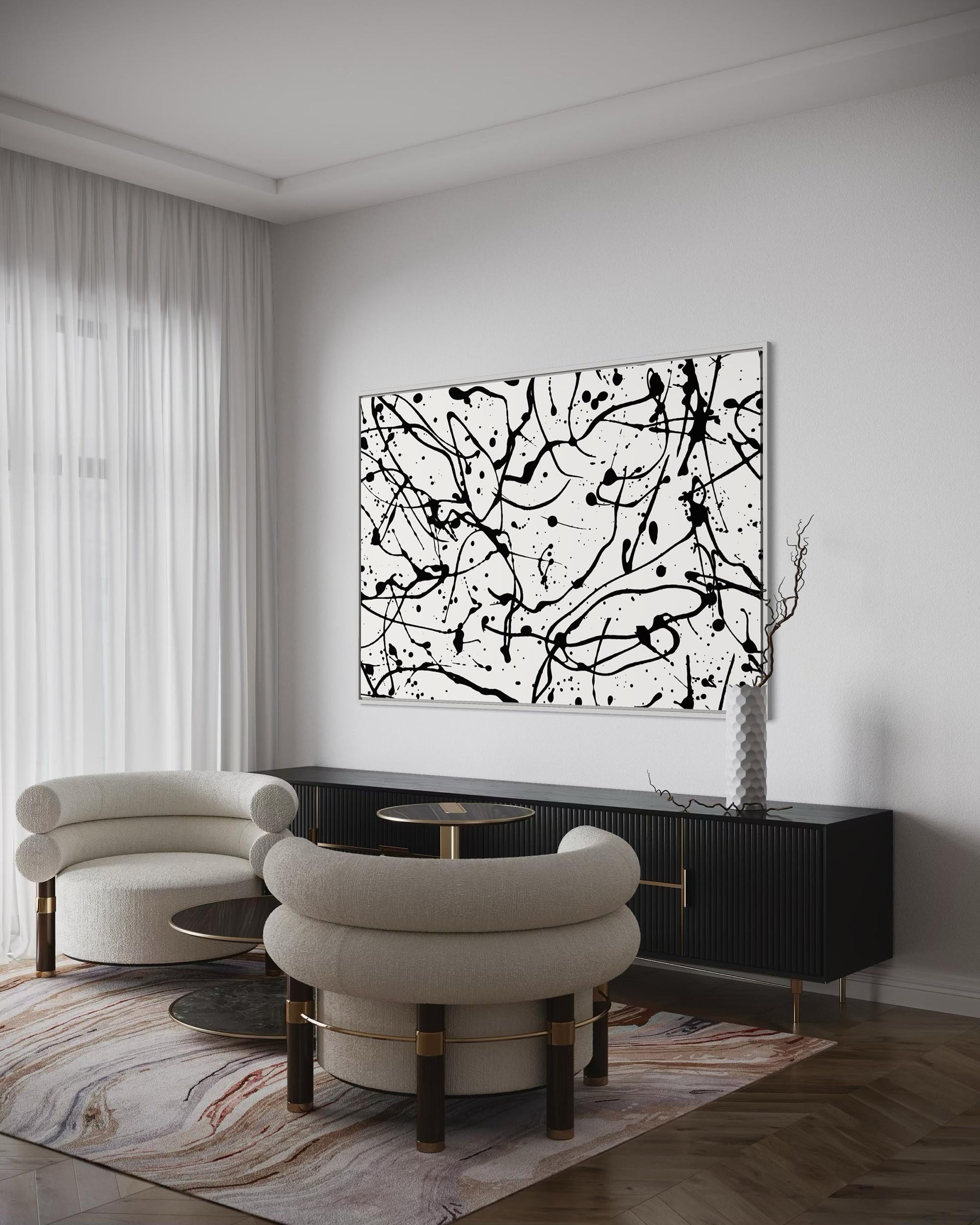Modern living room with abstract black and white painting on wall, white chairs, and a dark console table.
