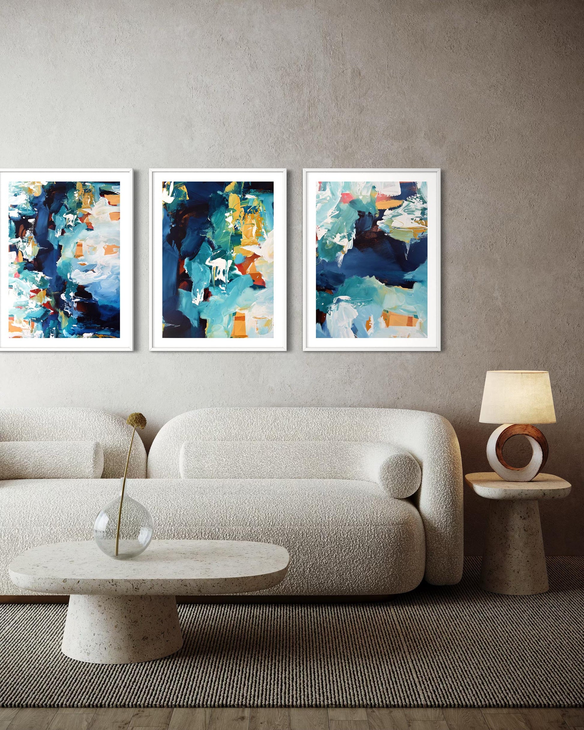 Modern living room with abstract art on the wall and a beige sofa.