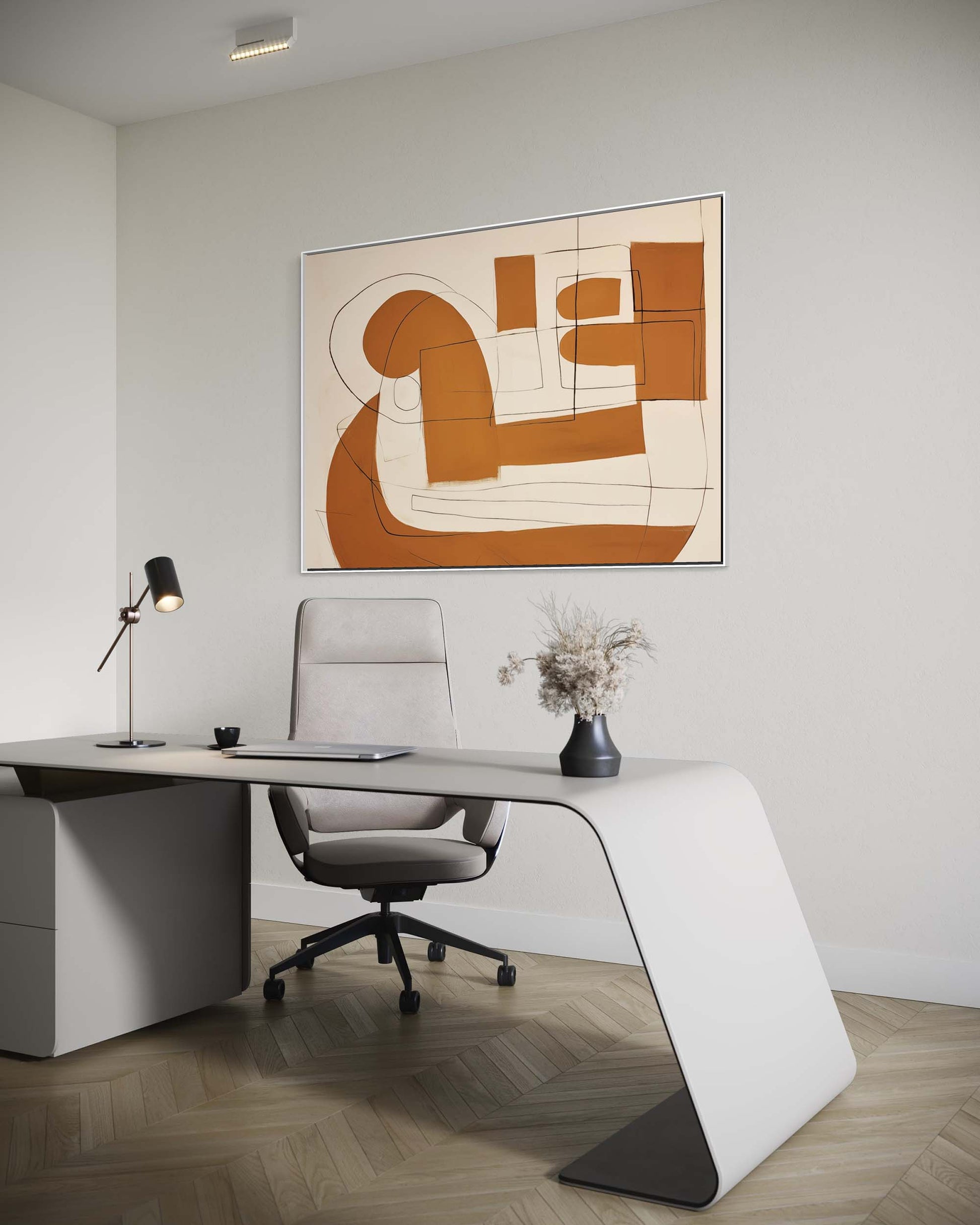 Modern office setup with a white L-shaped desk, gray chair, and abstract artwork on the wall.
