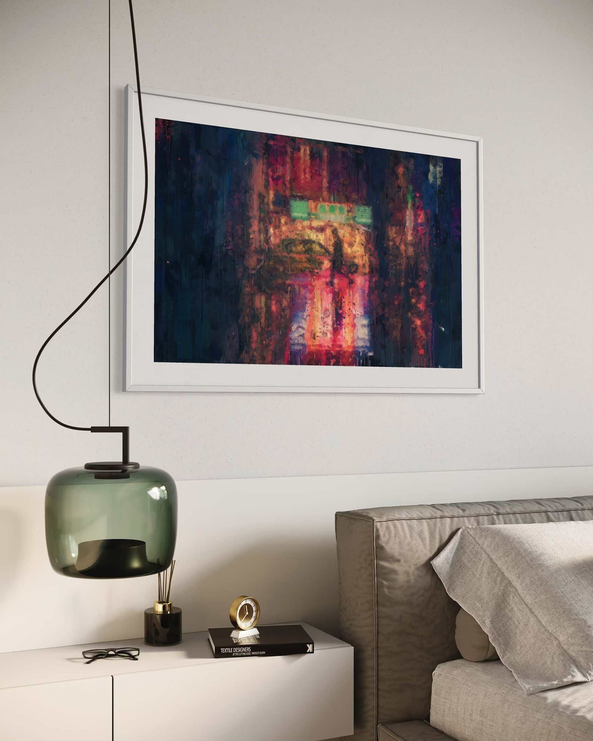 Framed abstract painting on a wall above a bed in a modern bedroom.