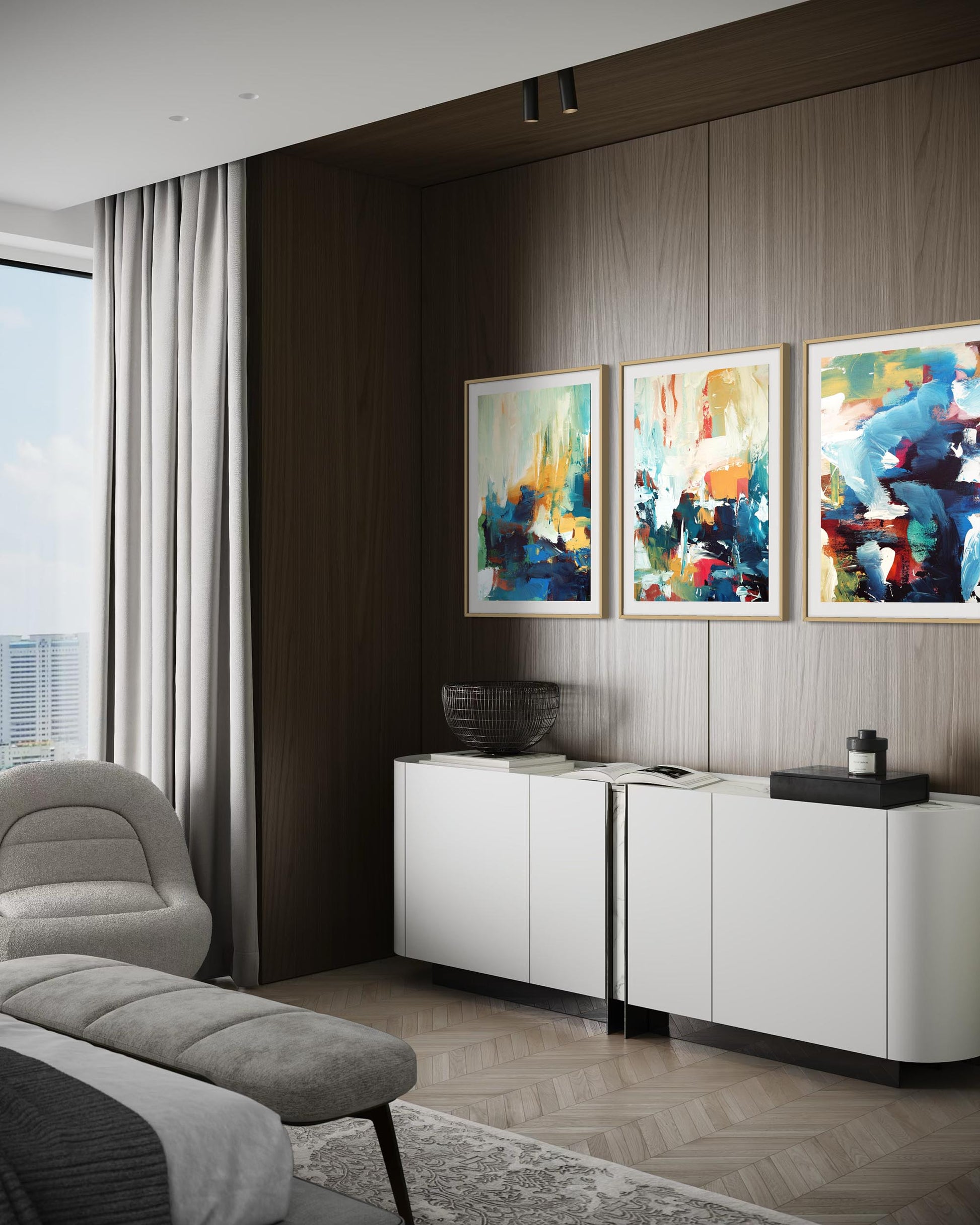 Modern living room with abstract art on the wall and a white cabinet.