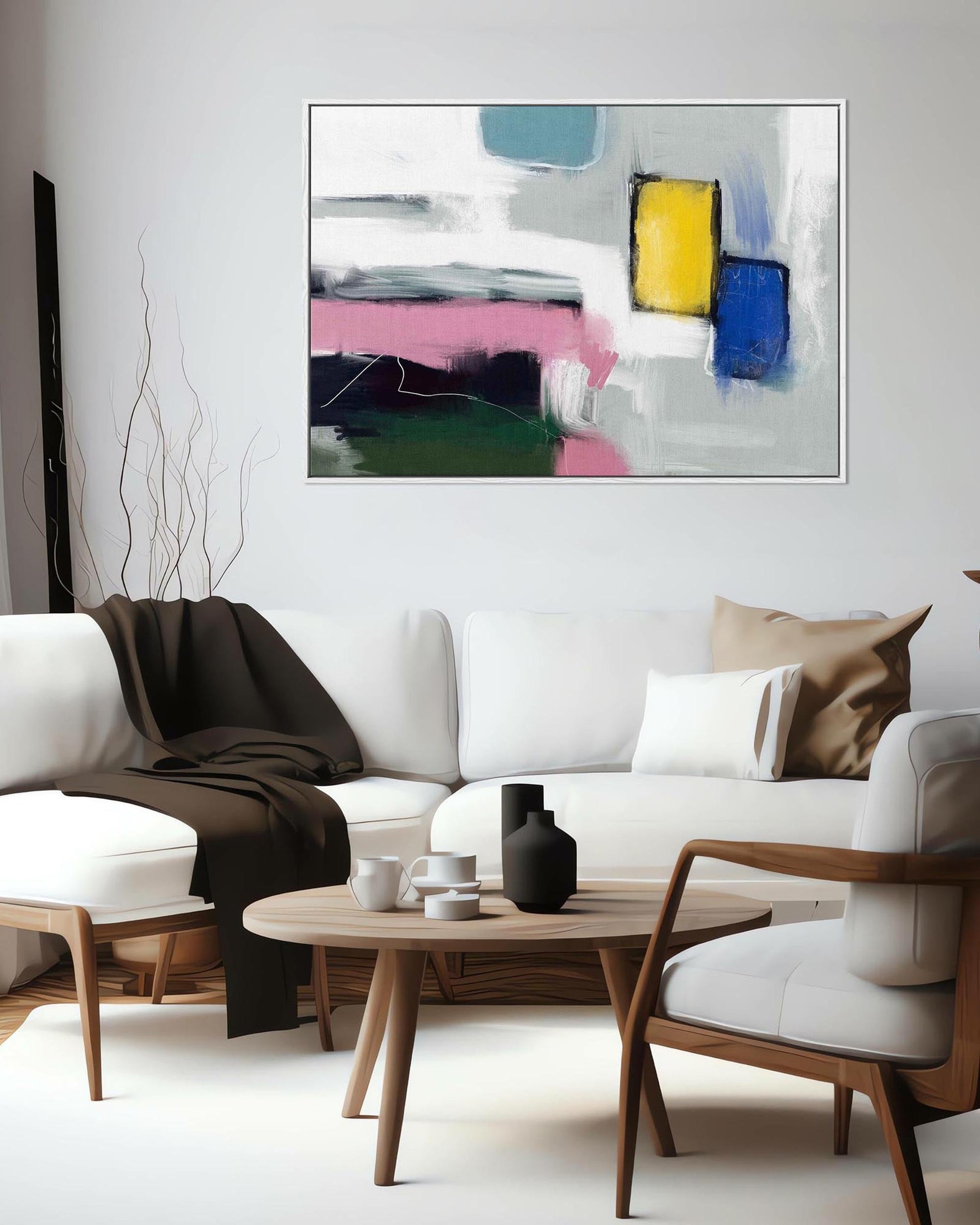 Modern living room with a white sofa, wooden coffee table, and abstract art on the wall.