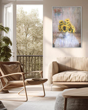 Modern living room with a beige sofa, wicker chair, and sunflower painting on the wall.