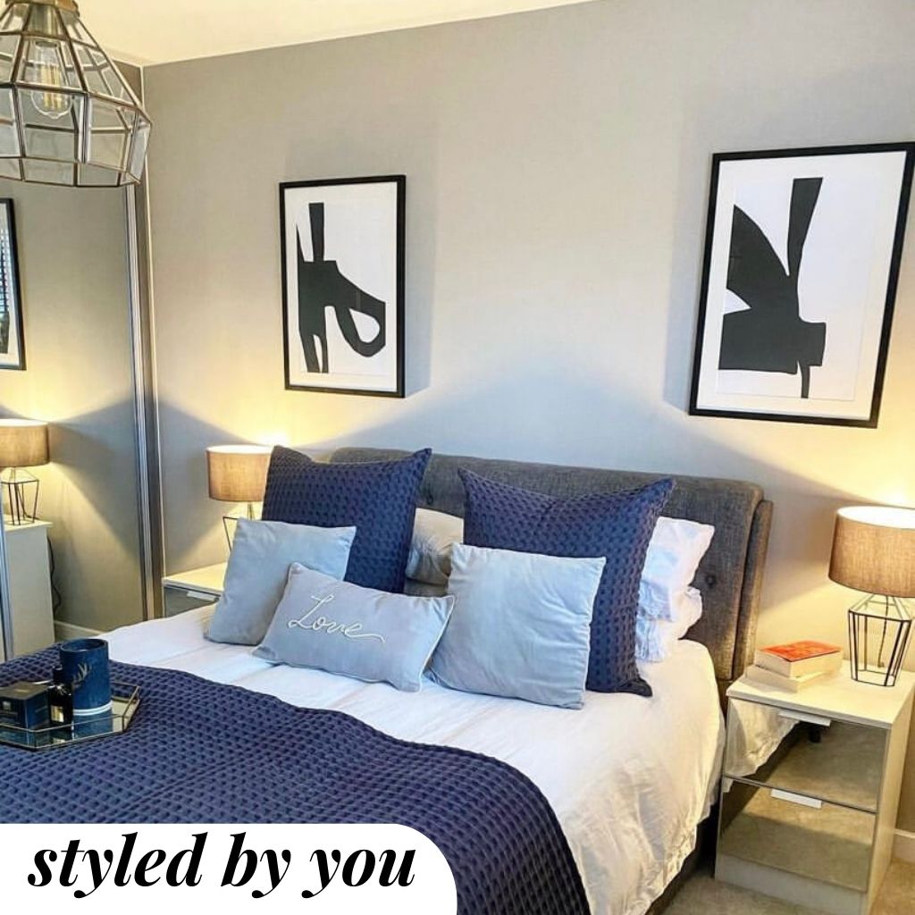 Framed print above a bed