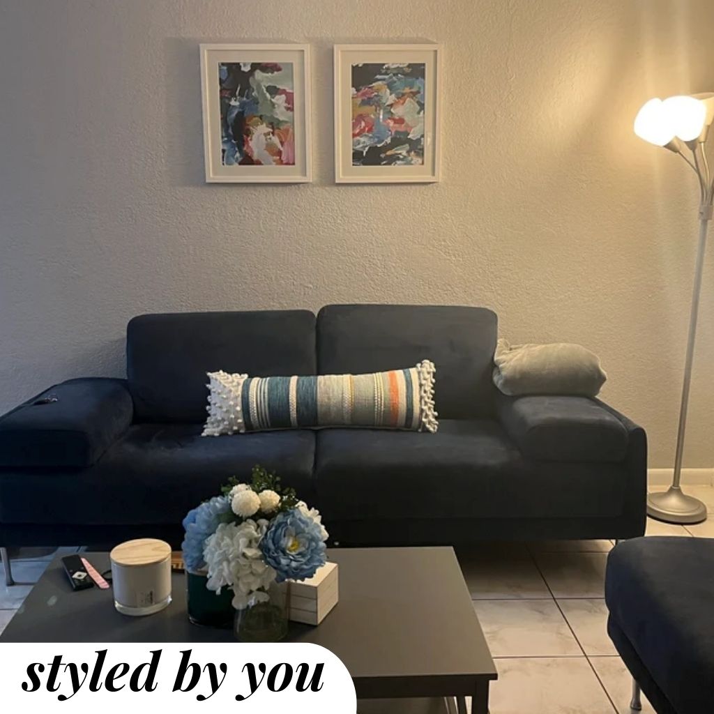 framed prints above a sofa