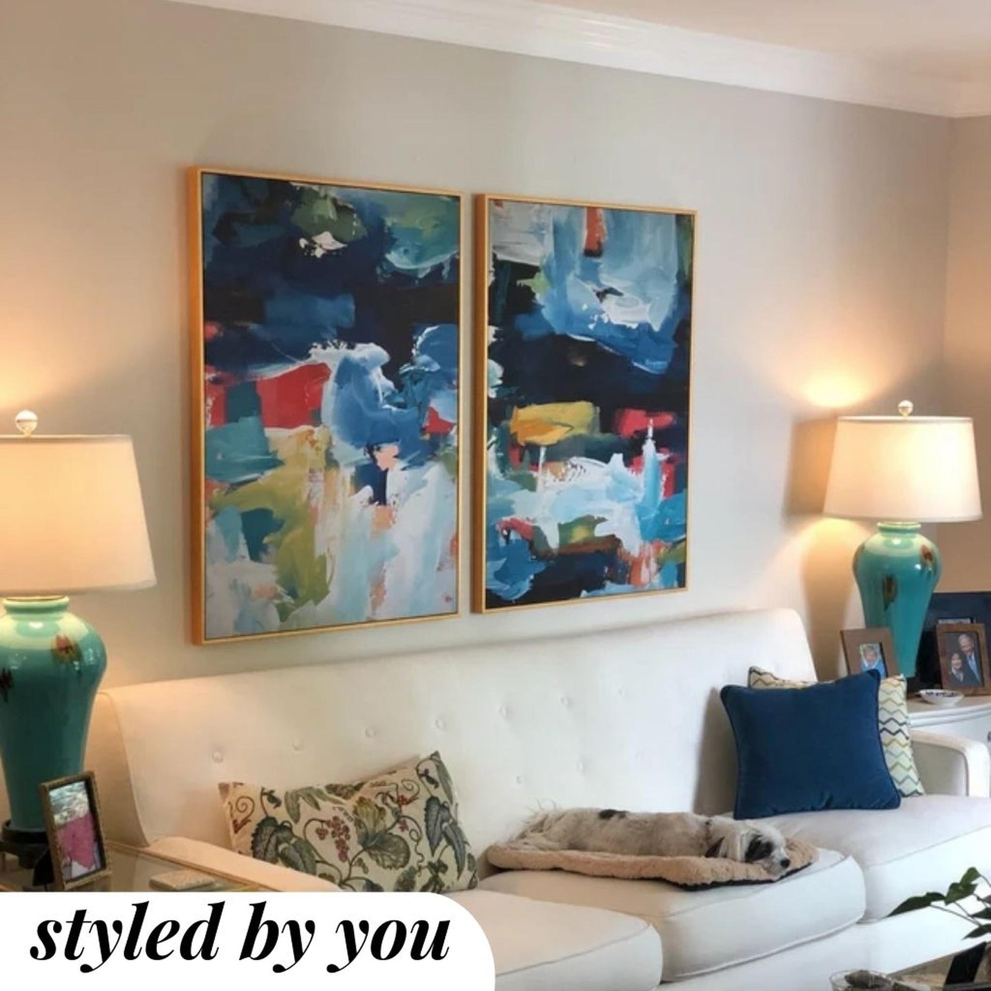 framed canvas prints above a sofa