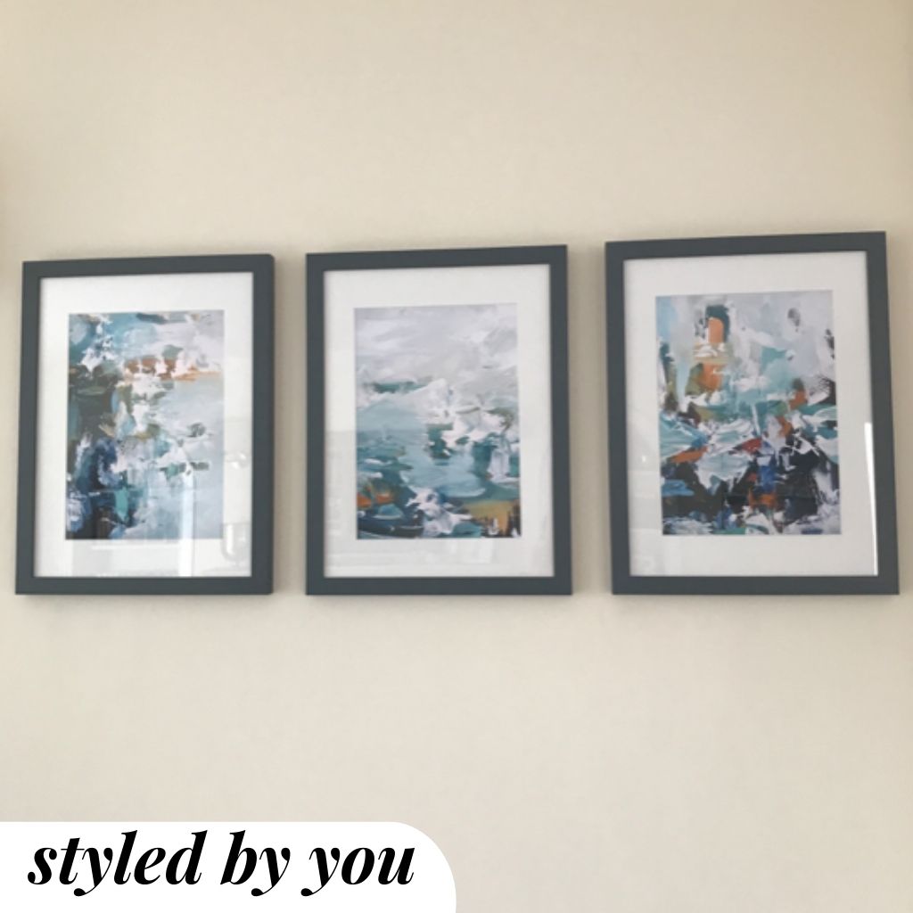 framed prints hung on wall
