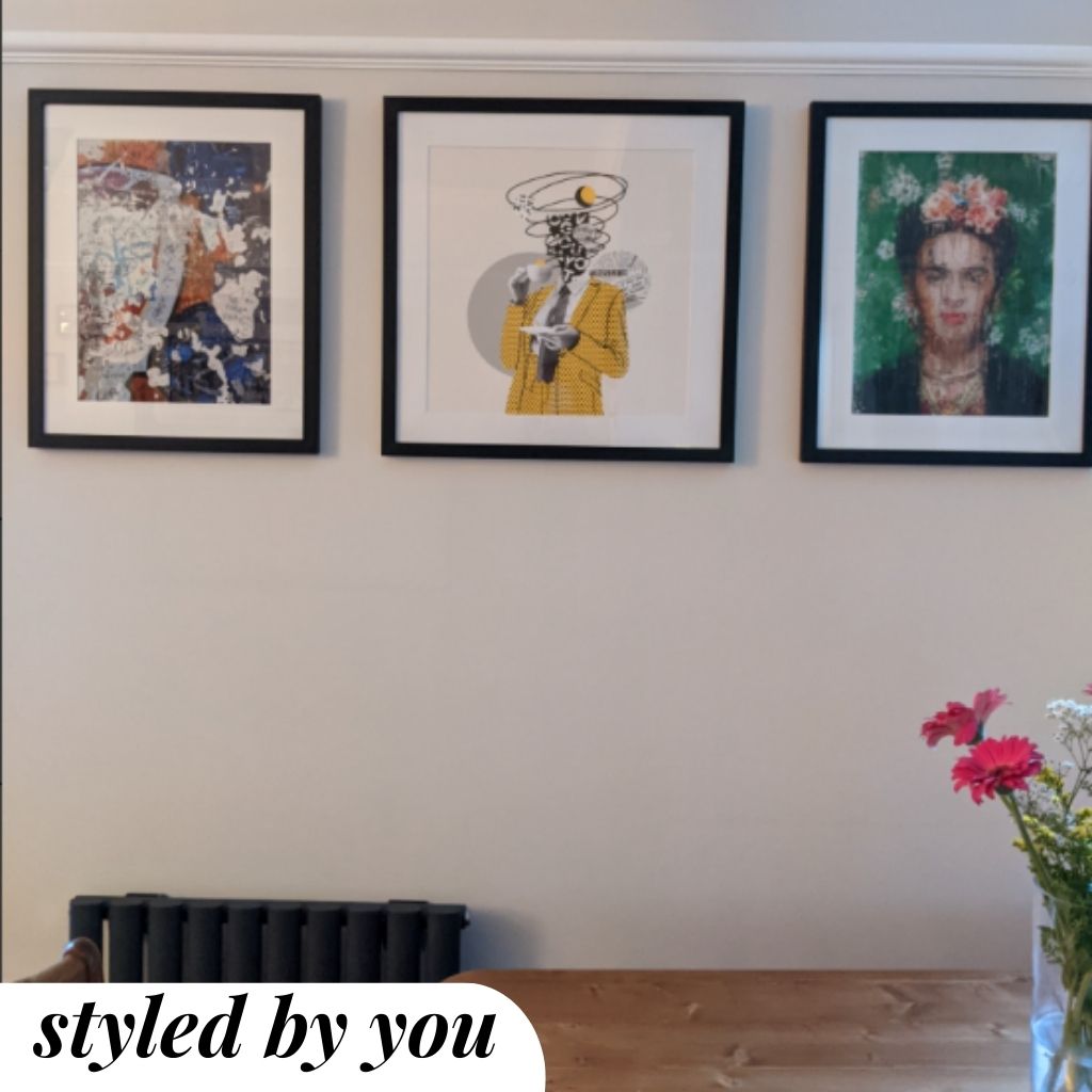 framed prints hung on wall