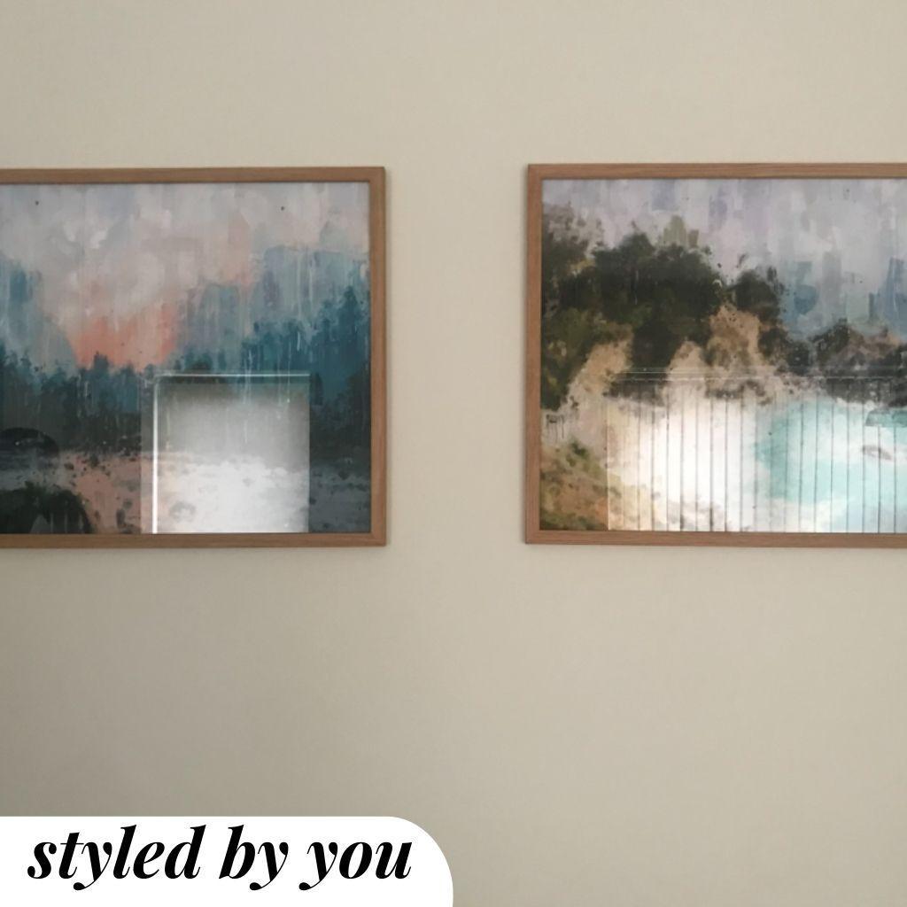 framed prints hung on a wall