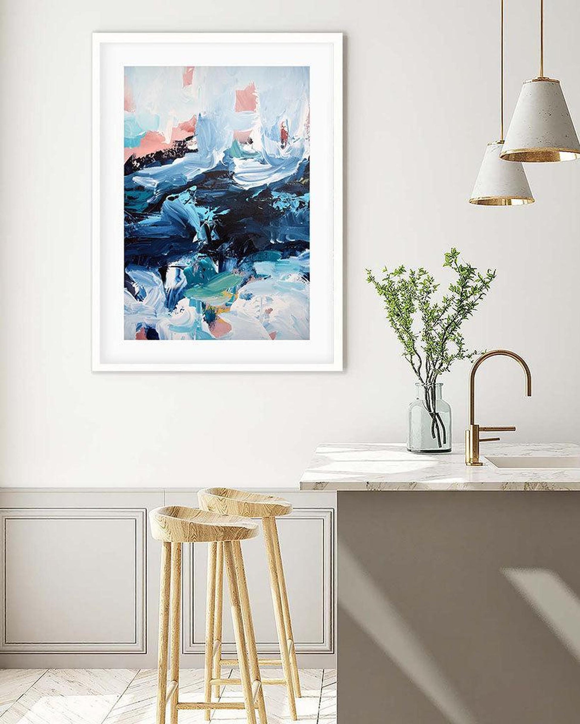 Abstract art print in a modern kitchen with stools and a vase.