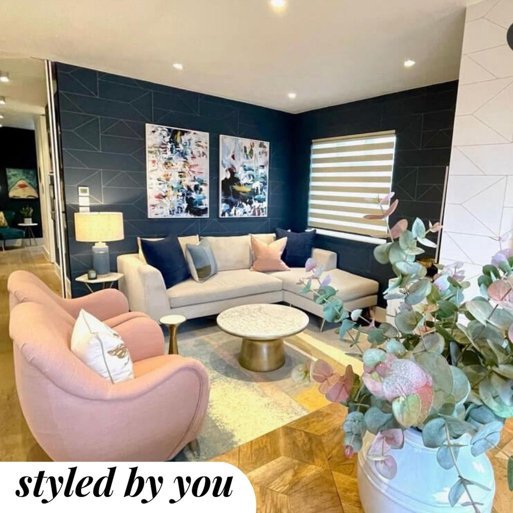 framed canvas prints hung in living room above a sofa