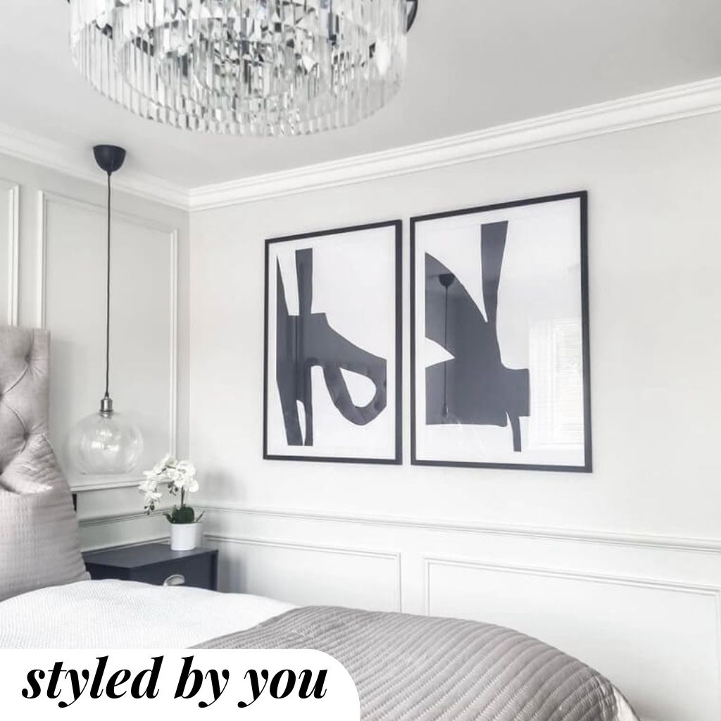 Framed print above a bed