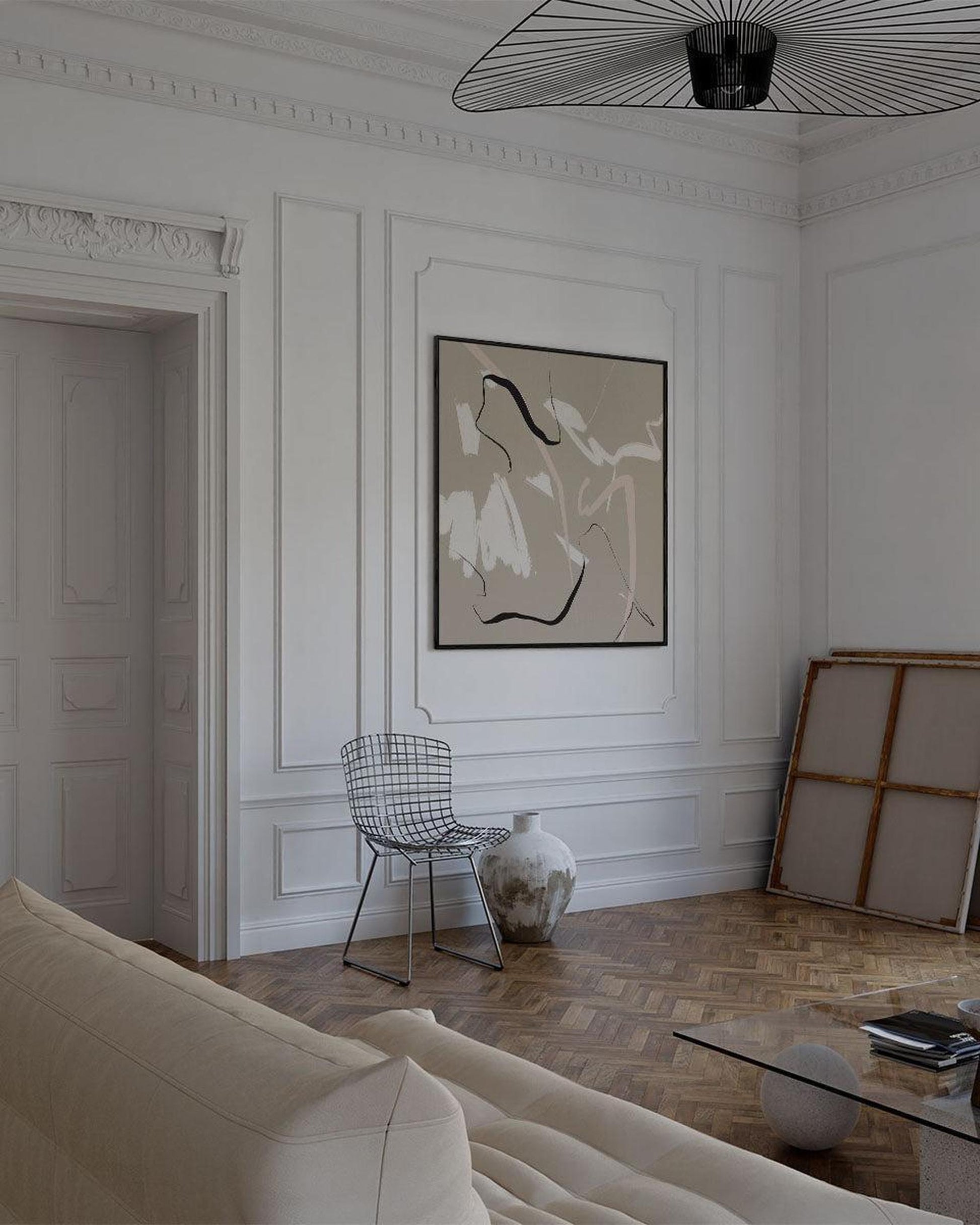Modern living room with white walls, a sofa, and a chair.