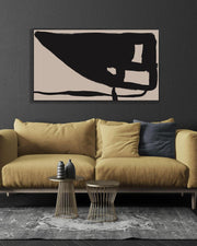Modern living room with a mustard yellow sofa, abstract art, and side tables.