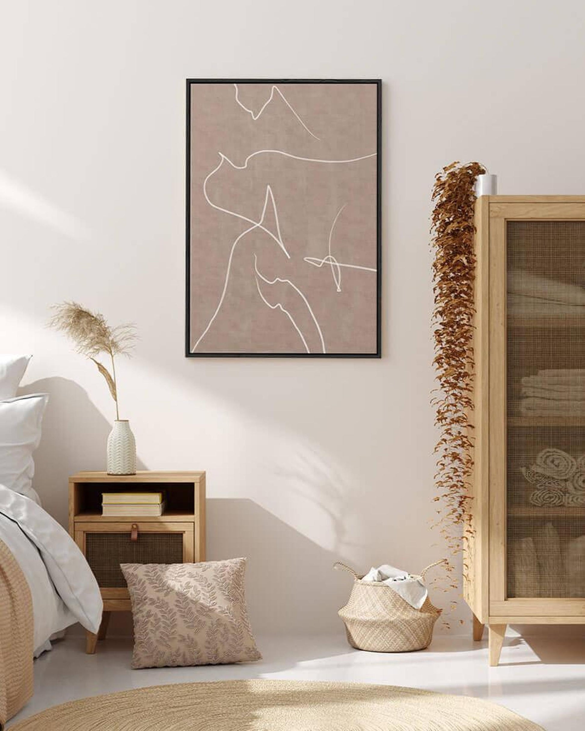 Nursery room with a framed abstract artwork on the wall, wooden nightstand, and decorative elements.