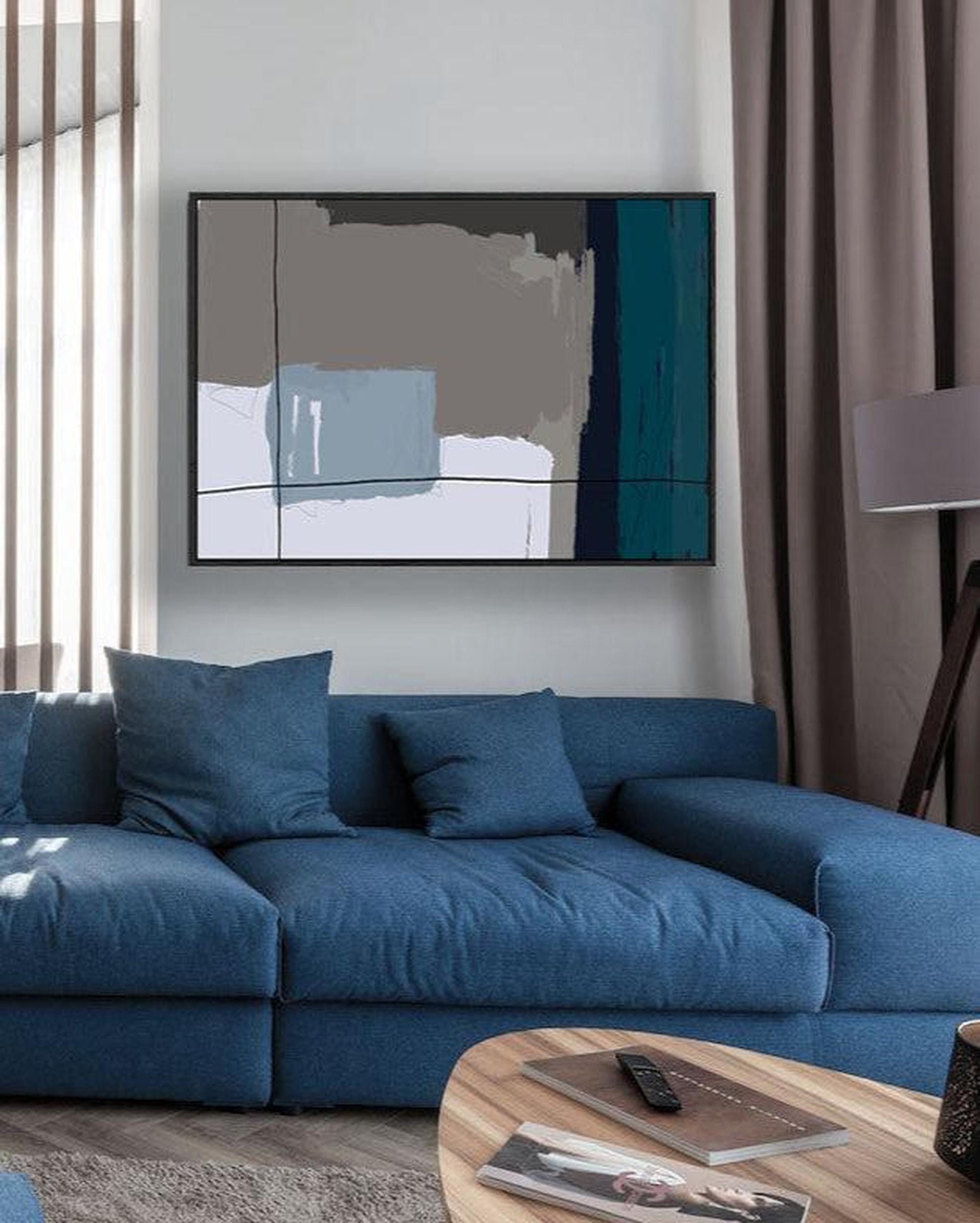 Blue sofa in a living room with a television and coffee table.