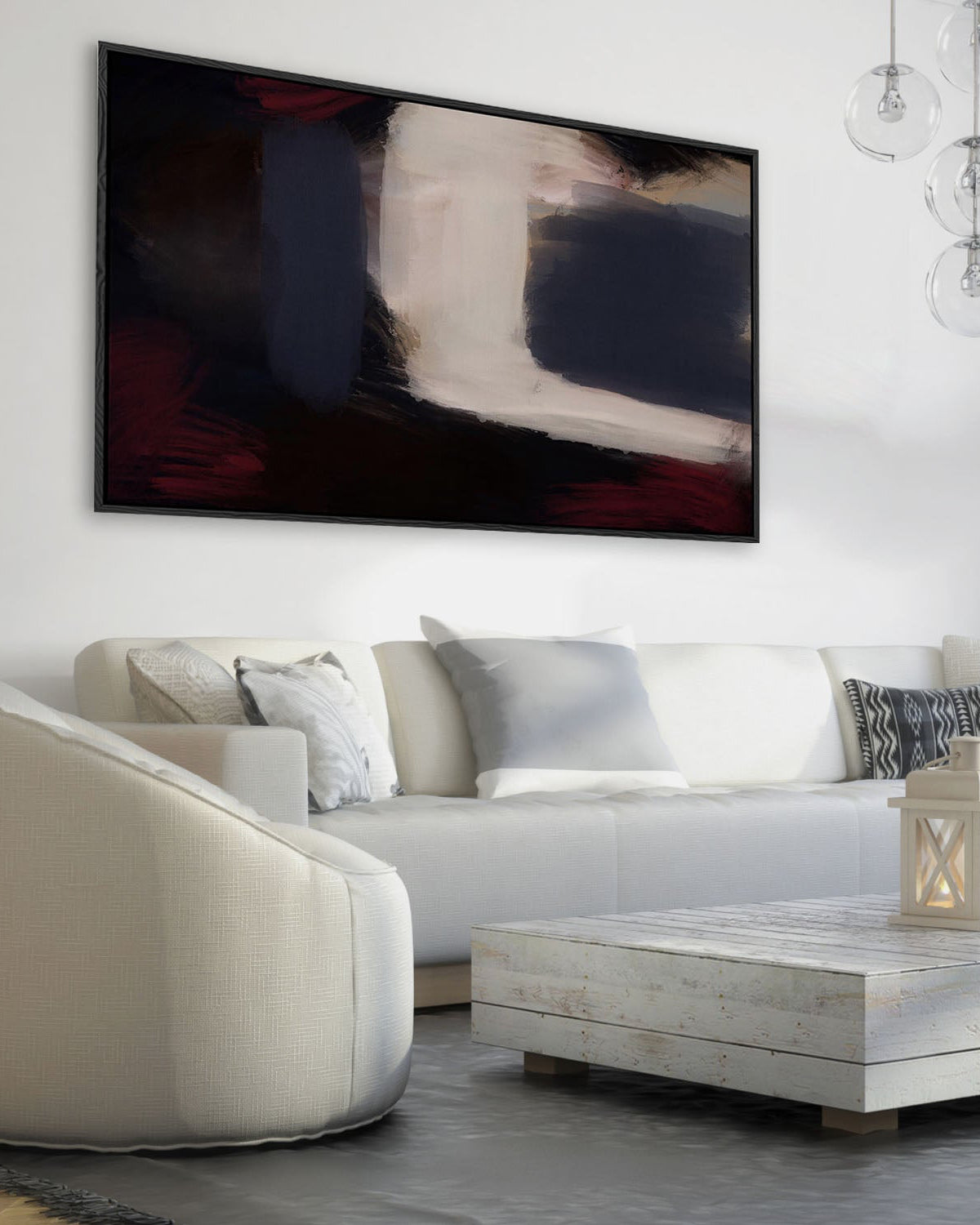 Modern living room with a white sofa, coffee table, and abstract painting on the wall.