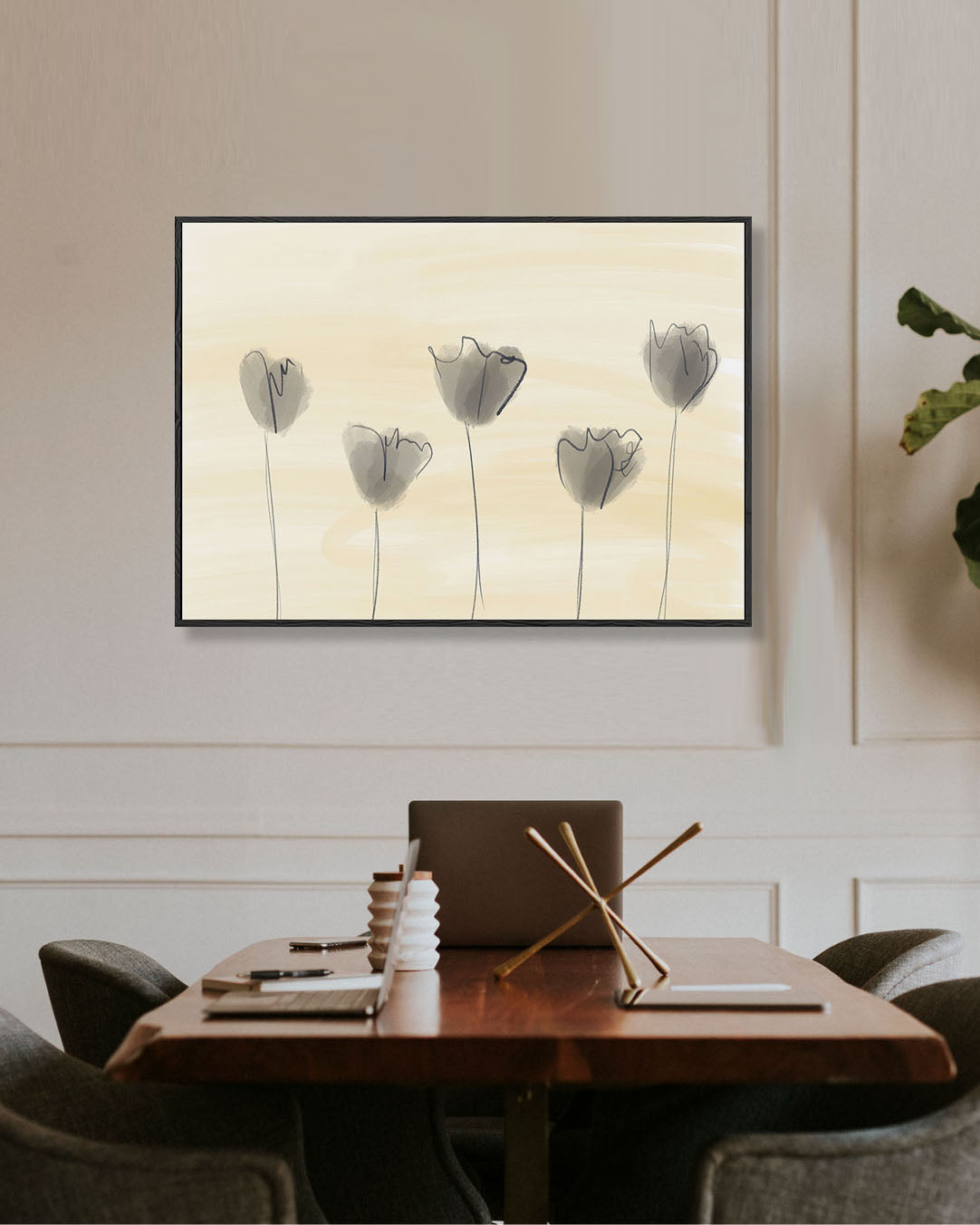 Framed artwork of tulips on a wall above a dining table.