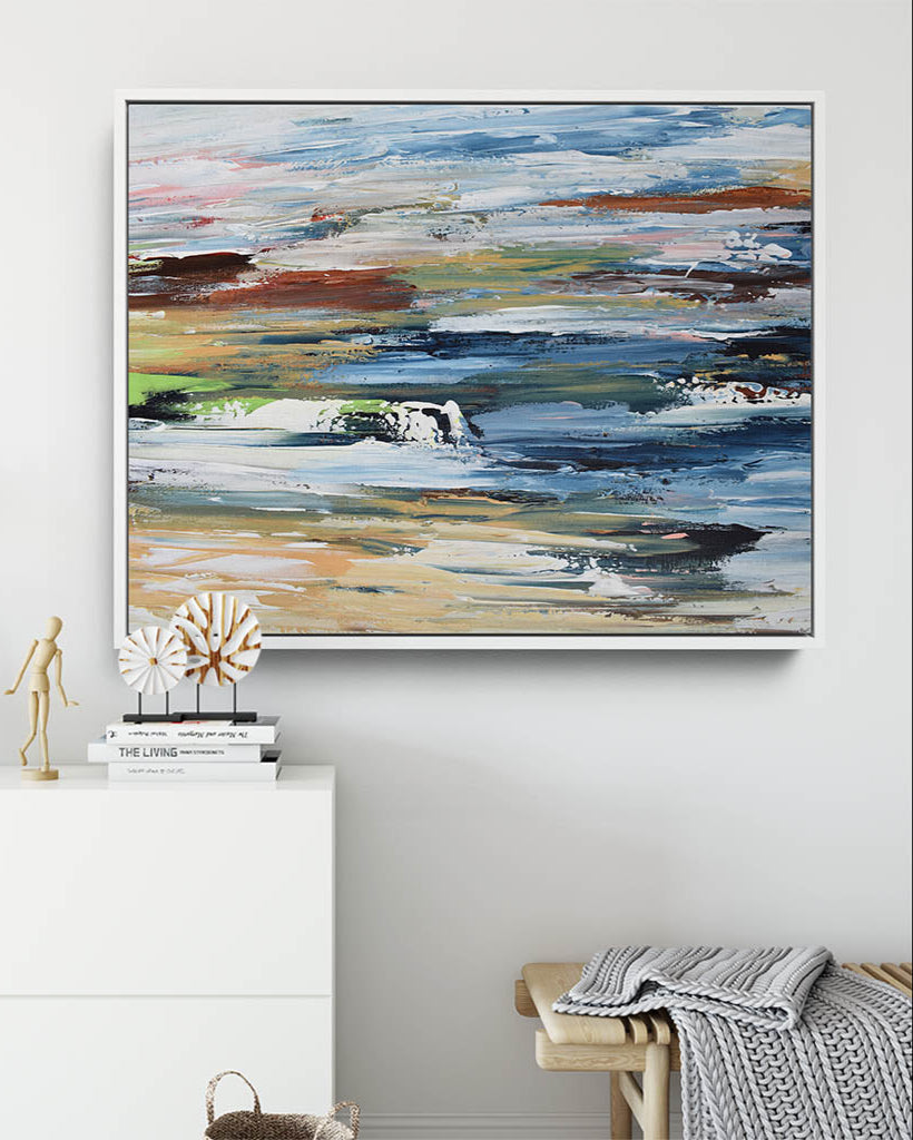 Abstract painting on a wall with decorative items below