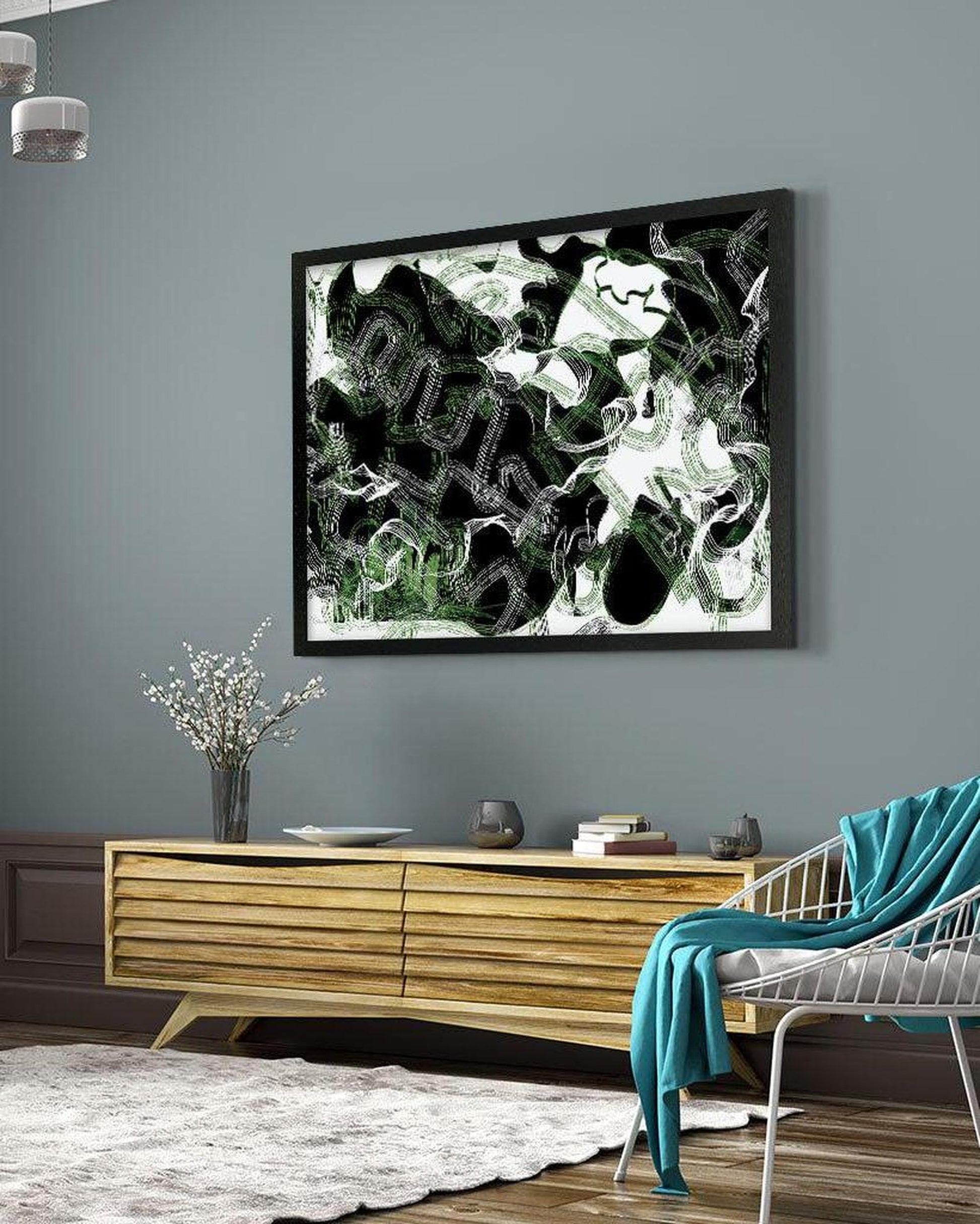 Abstract art piece on a gray wall above a wooden console table in a living room.