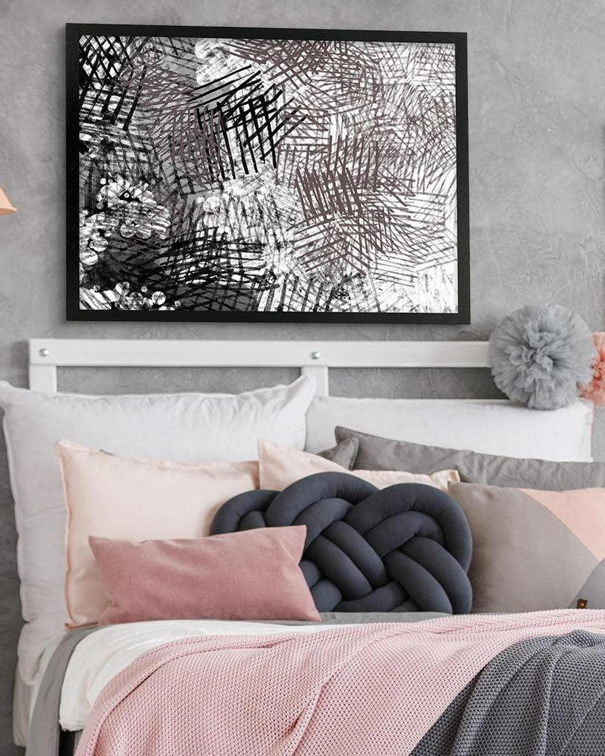 Bedroom with abstract art above the bed