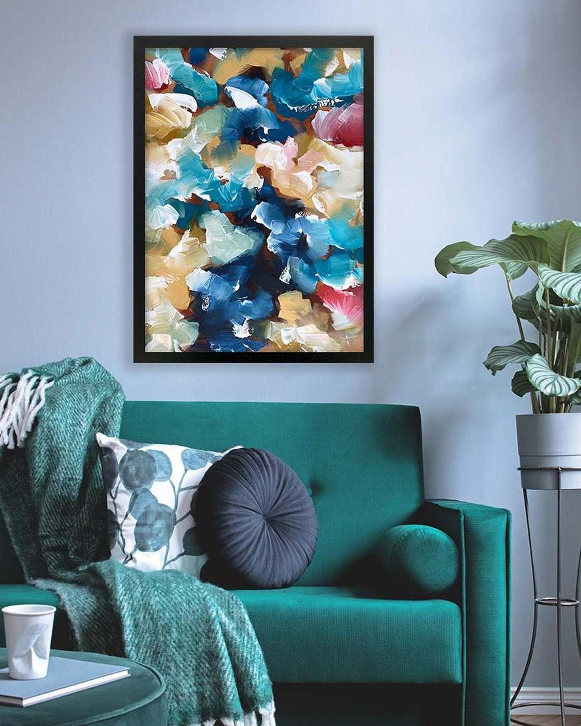 Living room with a teal sofa, colorful abstract painting, and a plant.