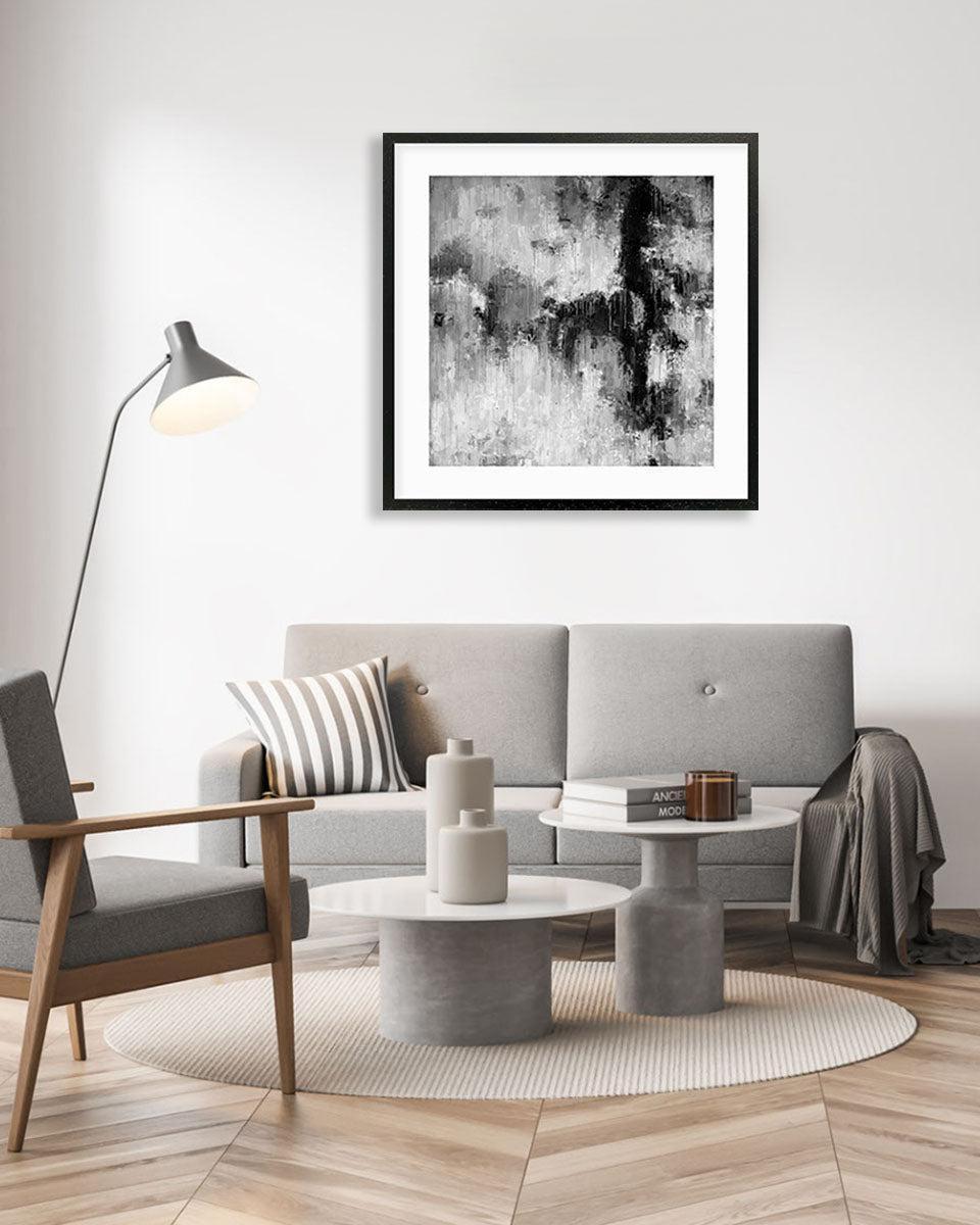 Modern living room with a gray sofa, armchair, and abstract art on the wall.