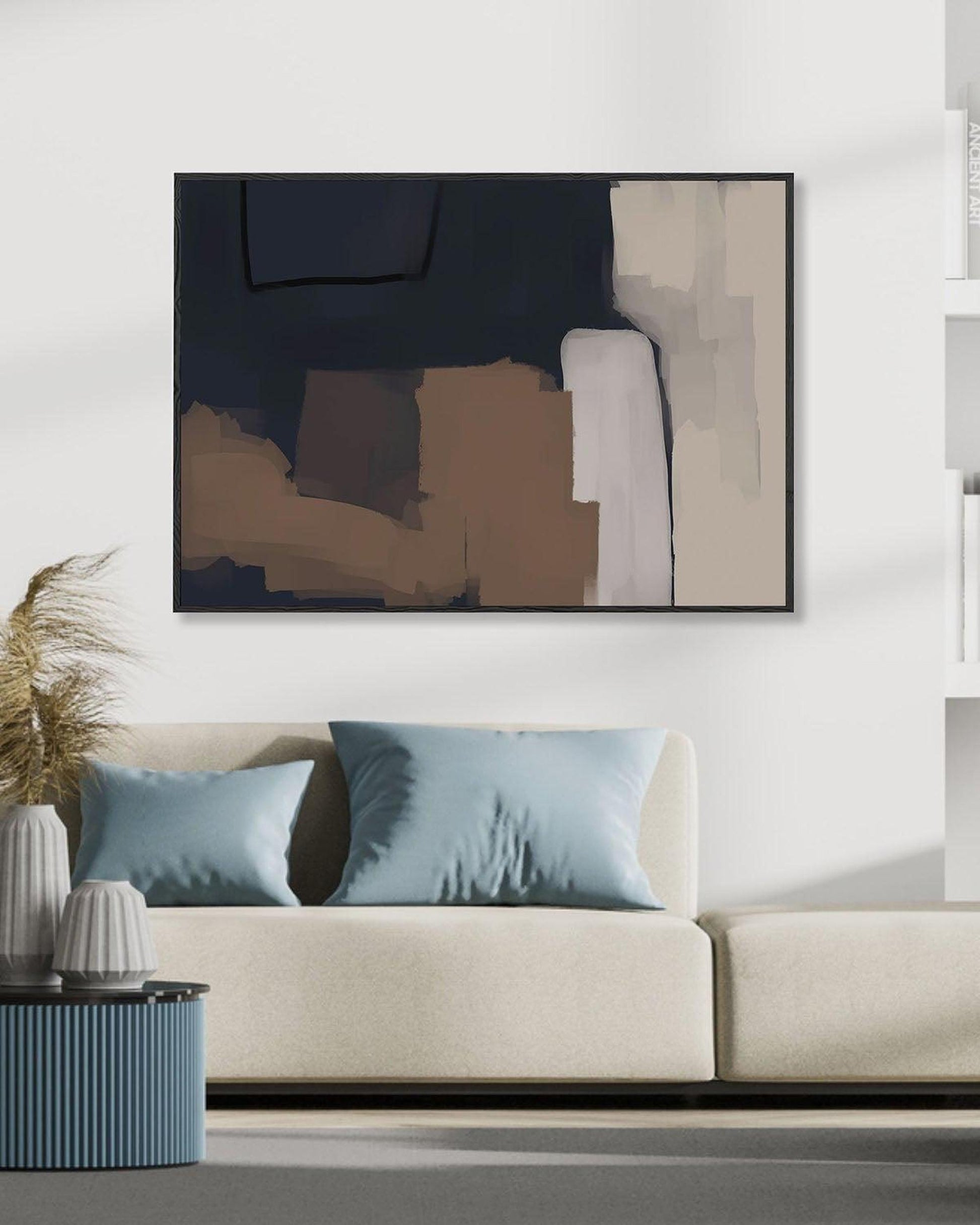 Modern living room with a white sofa, abstract art, and decorative items.