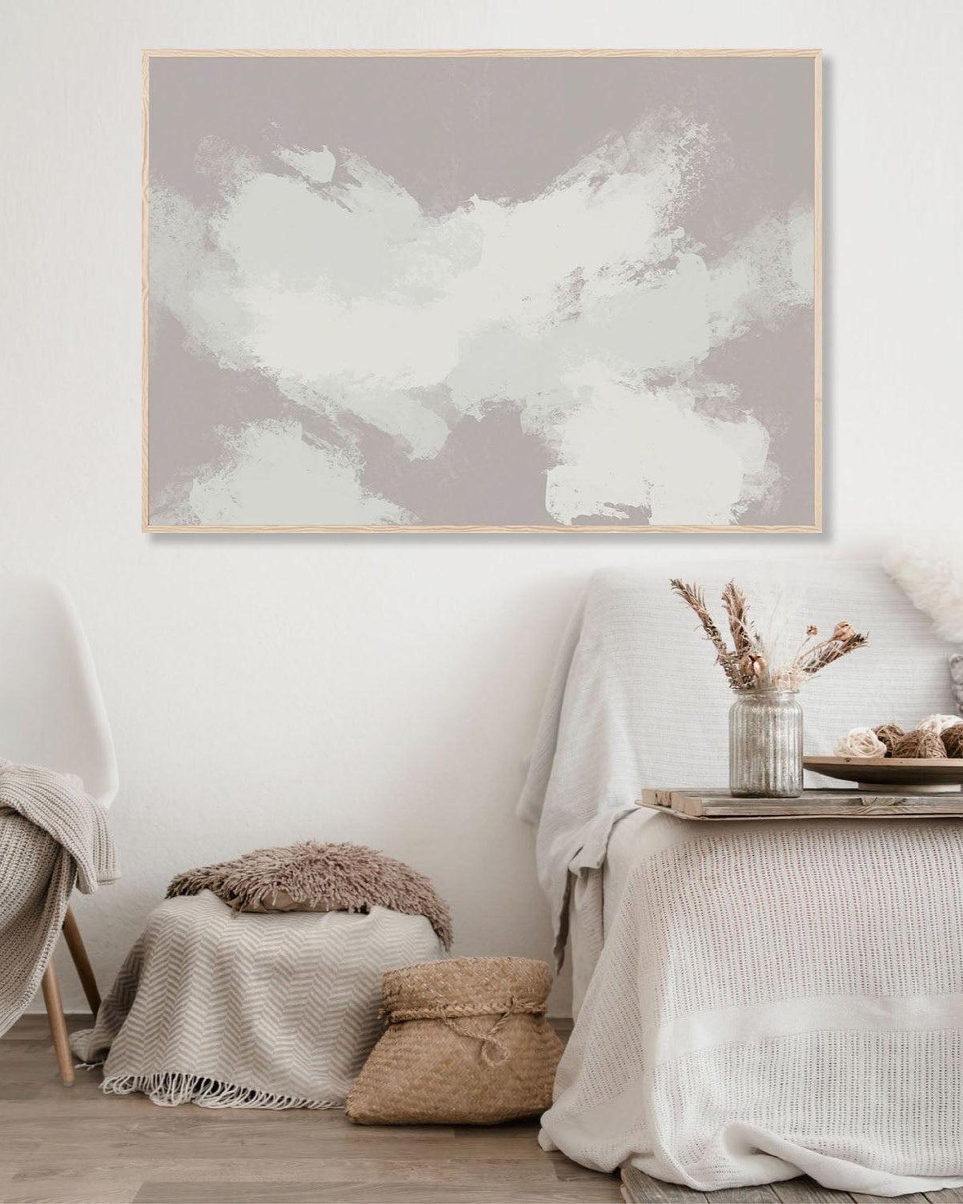 Framed abstract art on a wall in a cozy living room.