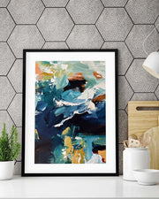Framed abstract art print on a wall with geometric pattern