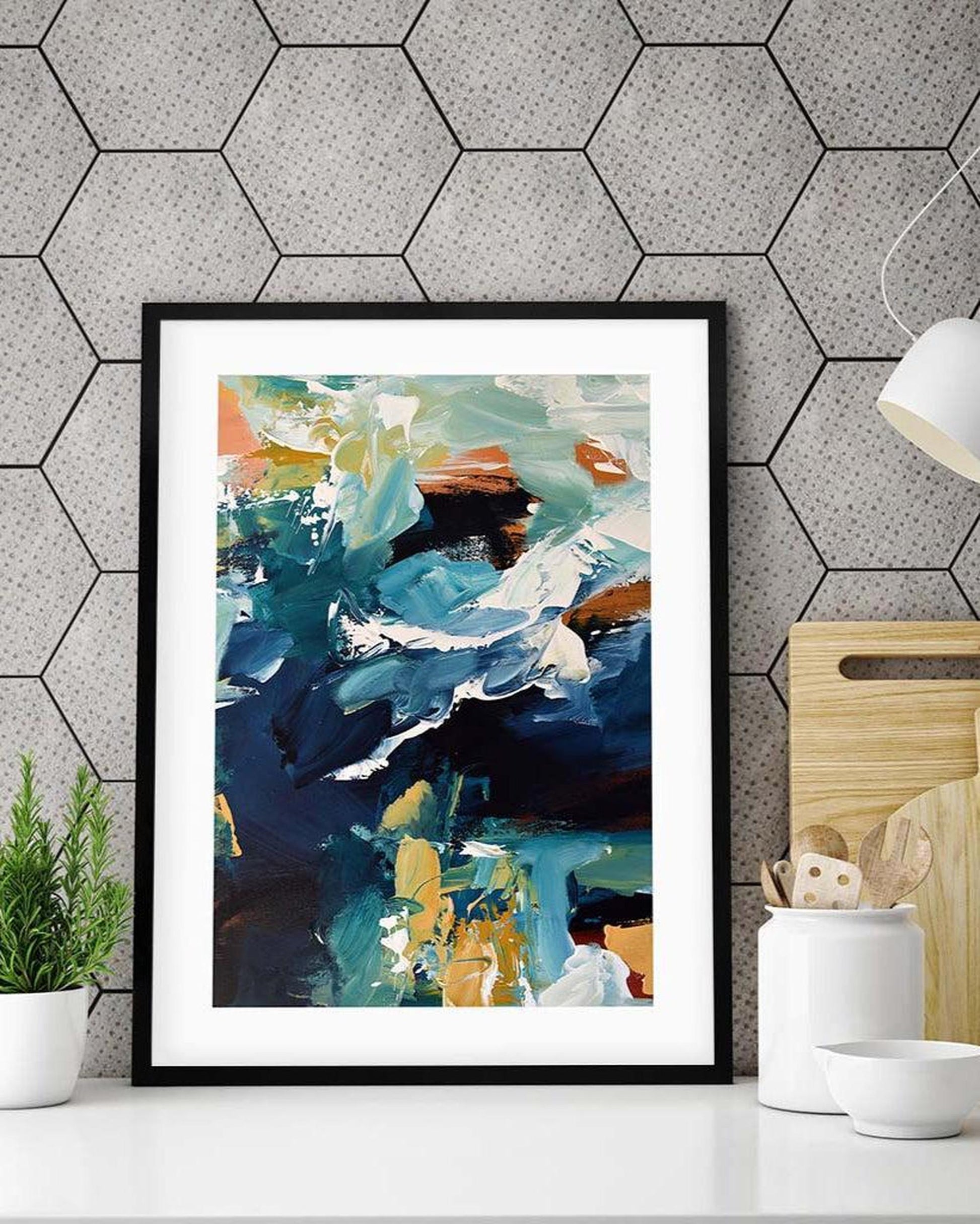 Framed abstract art print on a wall with geometric pattern