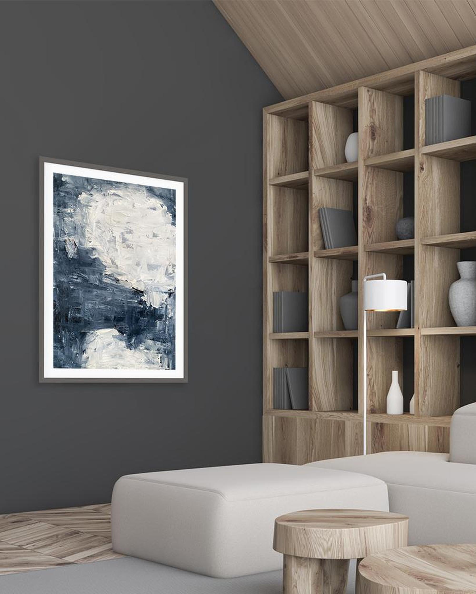 Modern living room with abstract art on the wall and wooden bookshelf.