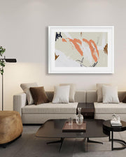 Modern living room with a gray sofa, coffee table, and abstract art on the wall.