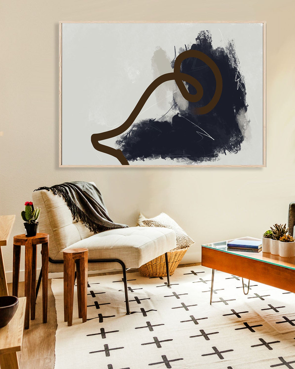 Living room with abstract art on the wall, modern furniture, and decorative elements.