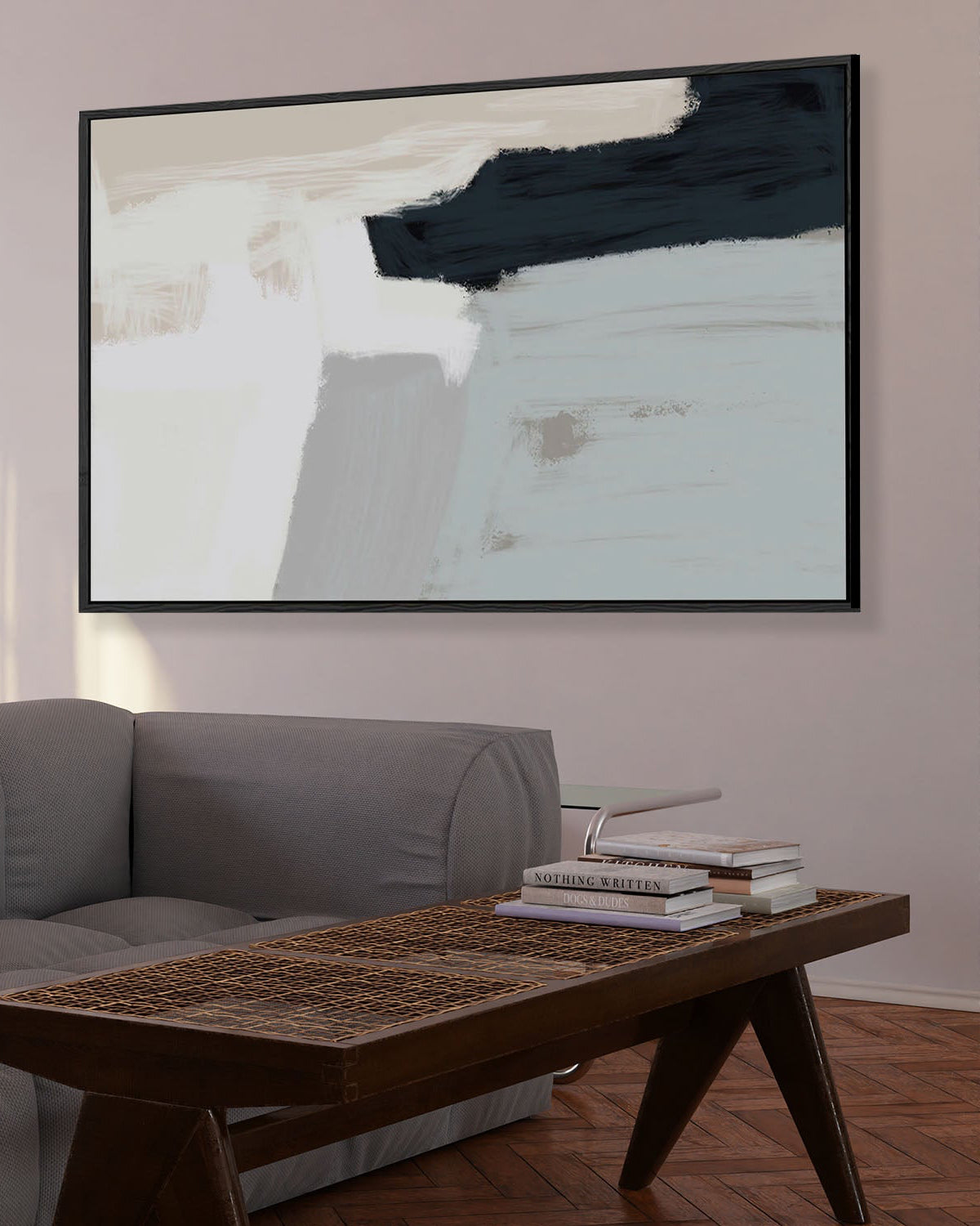 Abstract painting on a wall above a sofa and coffee table in a living room.
