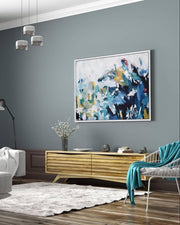 Modern living room with abstract painting on a gray wall