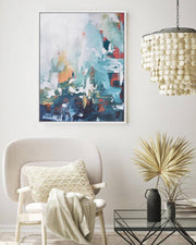 Modern living room with abstract art, chair, and decorative elements.