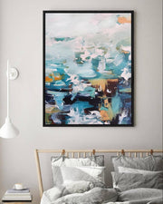 Abstract painting on a wall above a bed with striped bedding