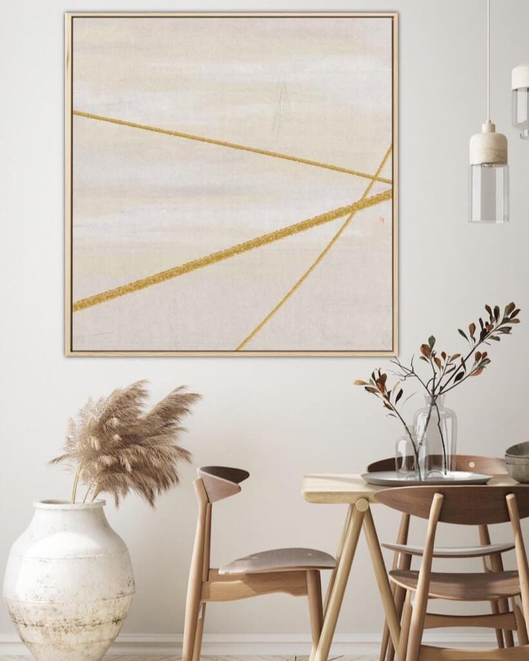 Dining room with abstract art, pampas grass, and wooden furniture.