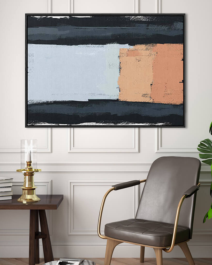 Abstract painting on a wall above a chair and side table in a room.