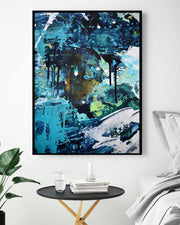 Abstract painting in a modern living room setting with a side table and plant.